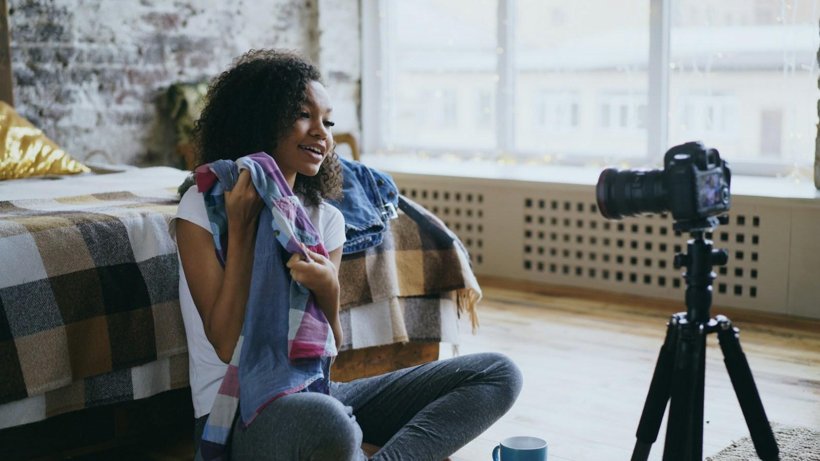 Creator presenting to a camera in a home studio